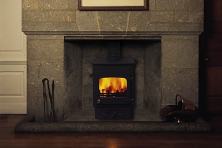 Woodwarm Fireview in a stone mantel