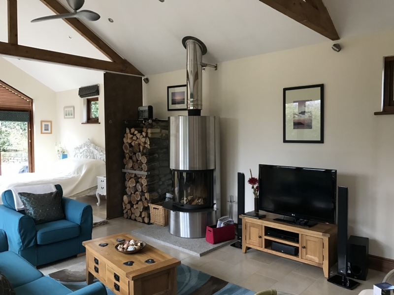 Scan Dsa 5 In Open Plan Bedroom Wood Burning Stove