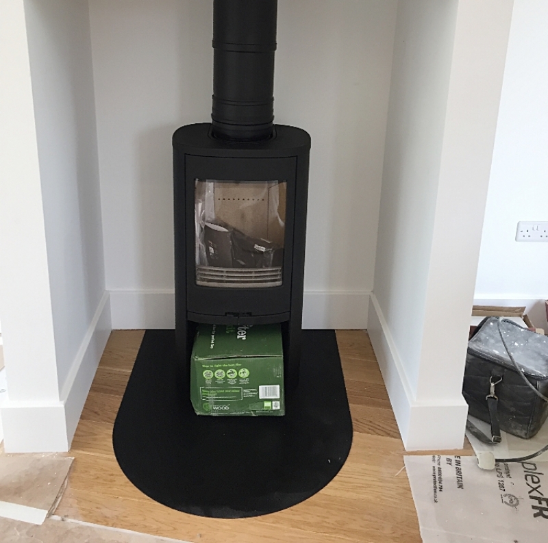 Contura woodburner in a fireplace