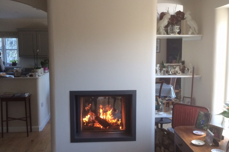 Stuv 21/75 doublesided woodburner installation