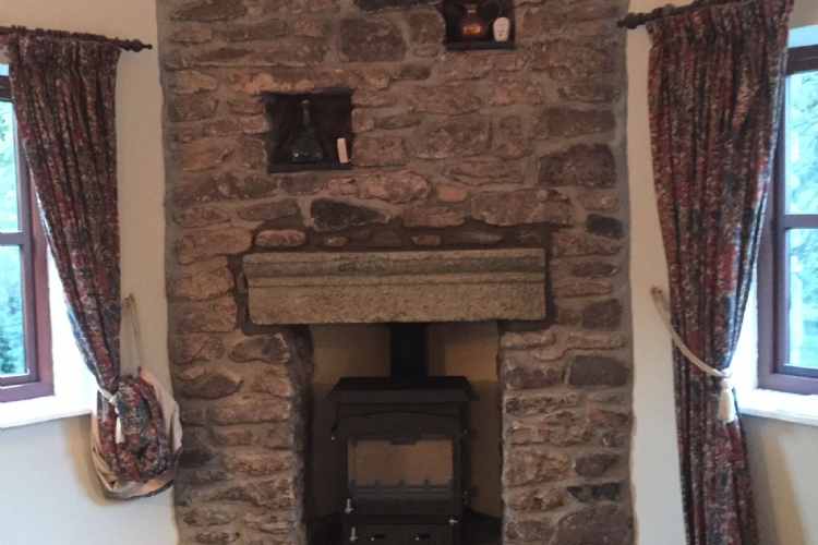 Adjusting a stone fireplace to fit a stove