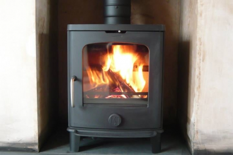 Scan Andersen woodburner in a newly plastered fireplace