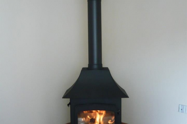 Woodwarm fireview with canopy on a tiled hearth
