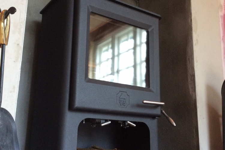 Replacing a fake Victorian fireplace with a wood burning stove
