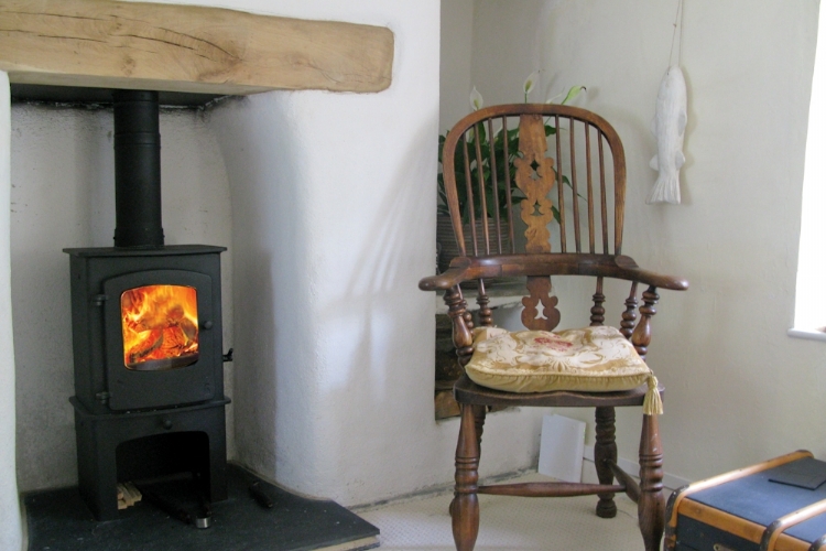 Charnwood Cove with log store installation