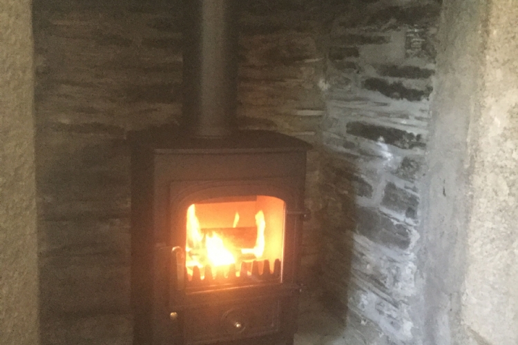 Clearview Pioneer in a Cornish stone fireplace