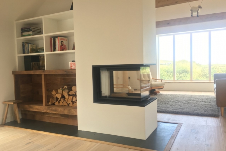 Three sided fireplace and feature wall