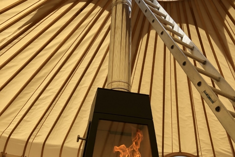 A woodburner in a marquee