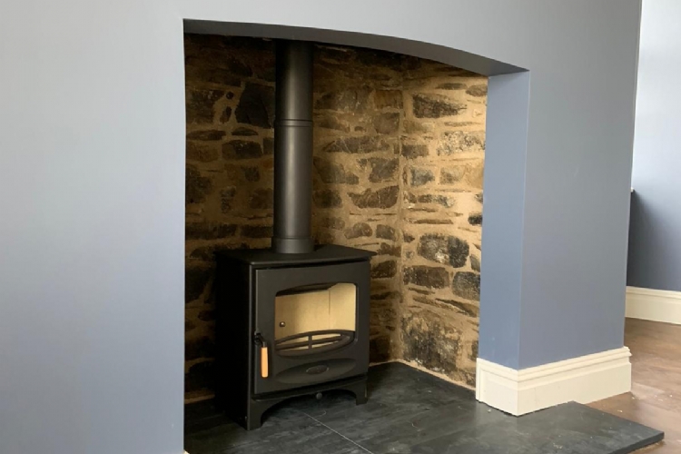 Charnwood C series in a simple fireplace