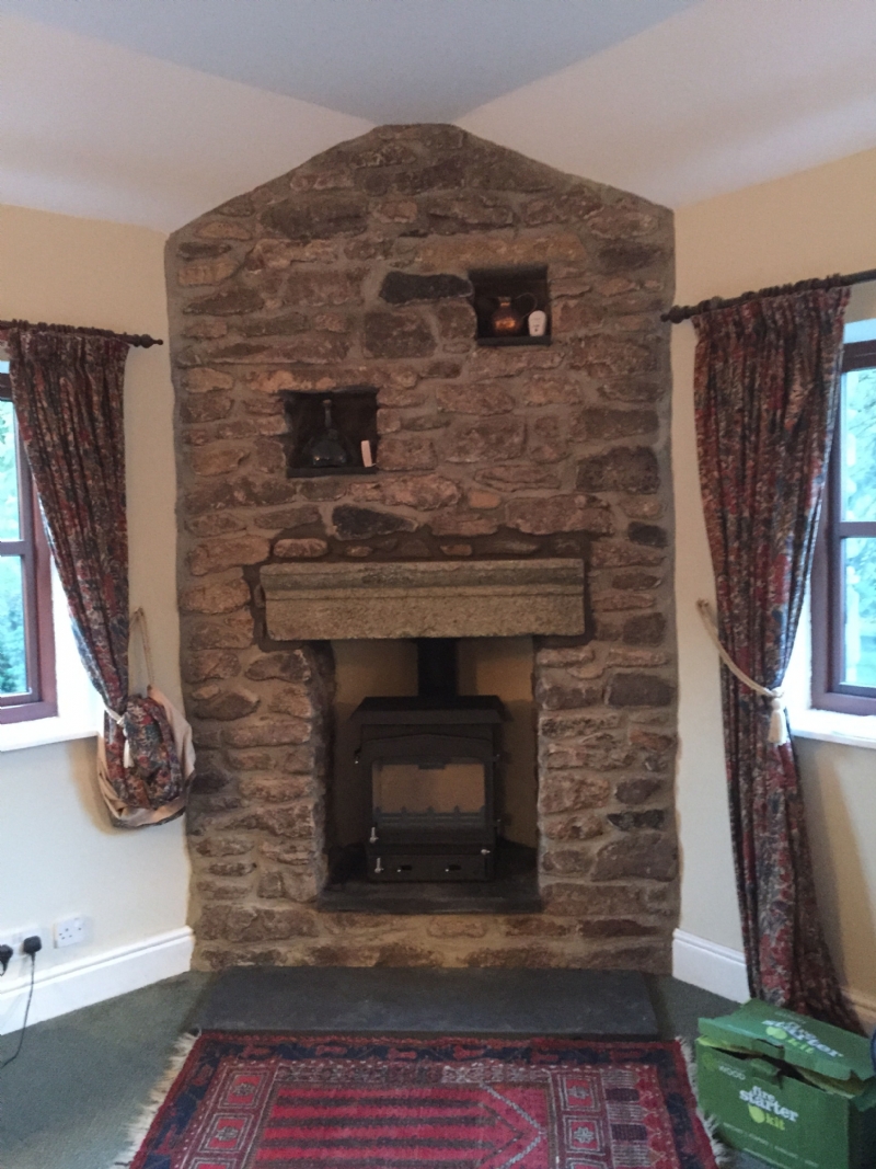 Adjusting a stone fireplace to fit a stove
