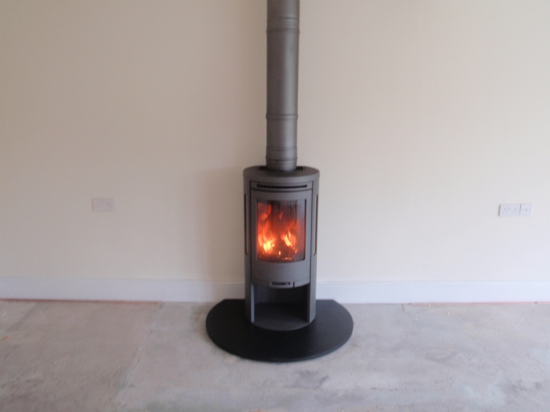 Contura 556 on a circular honed slate hearth