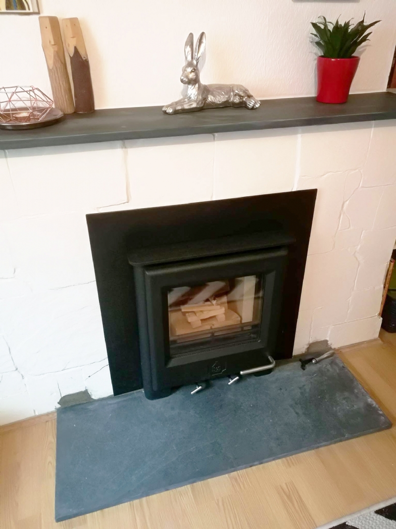 Woodwarm inset fire in brick