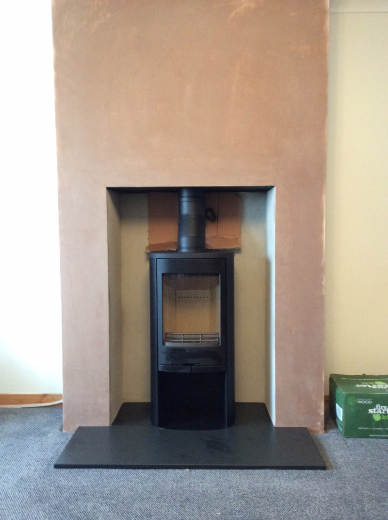 Contura 810 in freshly plastered fireplace